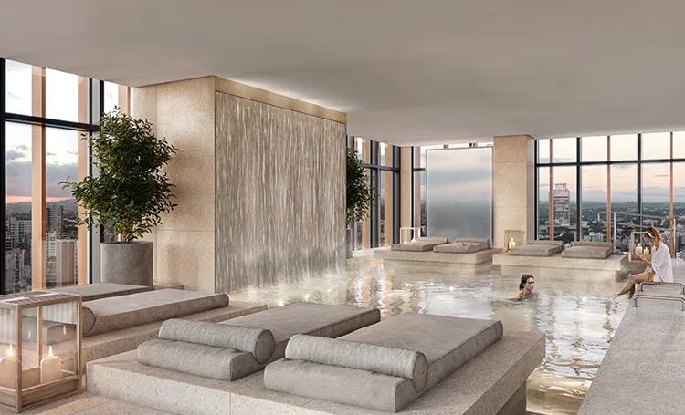 Área de bem-estar com spa, piscina e espreguiçadeiras de pedra