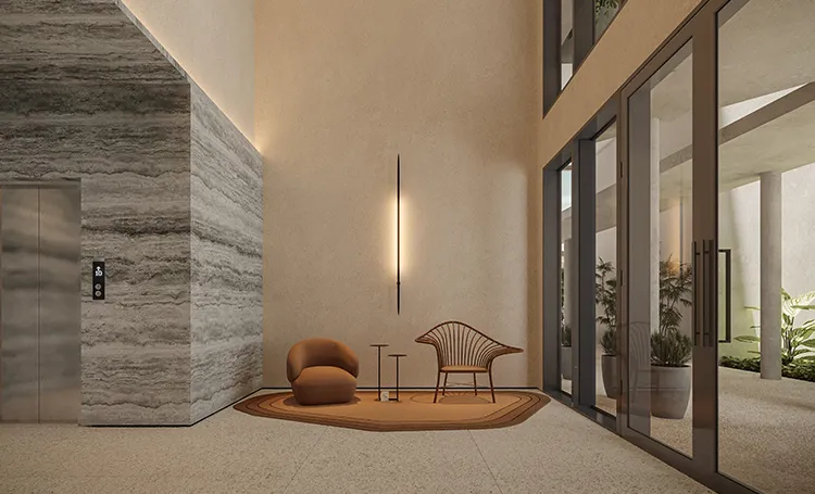 Hall com parede de pedra, elevador e poltronas sob pé-direito alto