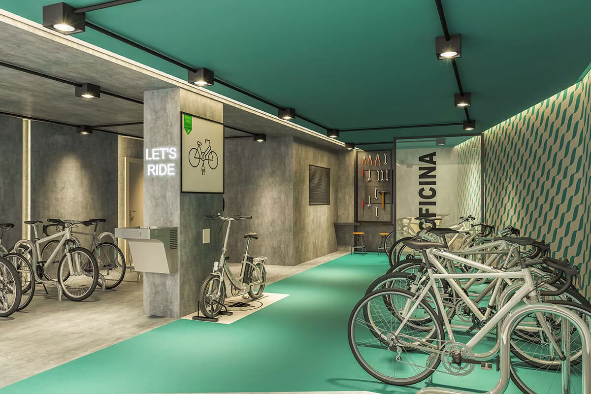 Bicicletário com oficina e paredes verdes, ALMÁA Cabral